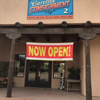 Carefree Consignment 2 - Sign - Carefree Consignment 2 storefront features a sign, a "Now Open!" banner, and a glass door entrance, indicating it is newly opened. - Used, Vintage & Consignment Near Me - Cave Creek, Arizona