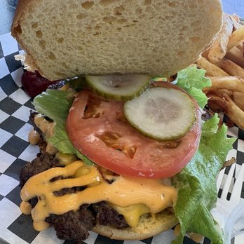 6ixside Burger - The east side burger - A burger with lettuce, tomato, pickles, melted cheese, and a beef patty on a sandwich bun, served with fries. - Burgers Near Me - Pickering, Ontario