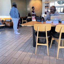 Starbucks - Why does he have books for sale & business cards setup at Starbucks?