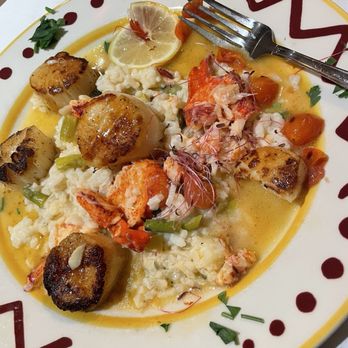 Dina's Bistro - Scallops with Lobster and shrimp over rice - New American Near Me - Toms River, New Jersey