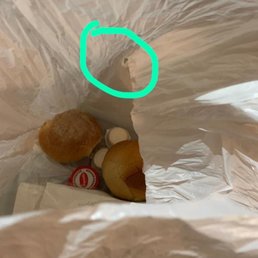 Bread was served in a plastic bag with a hole in it.