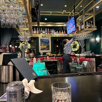 The Common Good - a bartender at a bar - New American Near Me - Aurora, Colorado