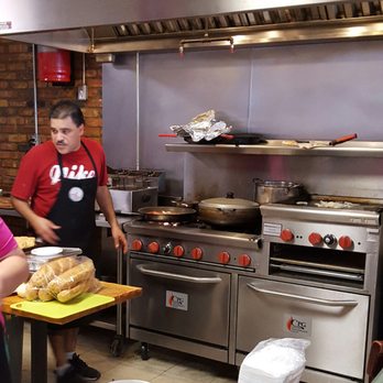 El Flamboyan - Owner and chef in the kitchen - Puerto Rican Near Me - Wylie, Texas El Flamboyan - Owner and chef in the kitchen - Puerto Rican Near Me - Wylie, Texas