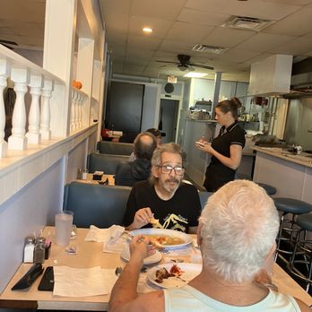 Courtneys Cafe - Tables and kitchen - Cafes Near Me - Atlantis, Florida Courtneys Cafe - Tables and kitchen - Cafes Near Me - Atlantis, Florida