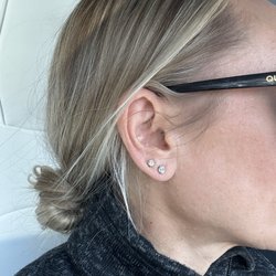 Jeweler By Design - Diamond studs in the first hole that were crafted from my diamond bracelet. They made it with 14 karat gold.