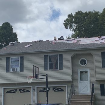 The Roofers - Working on the roof. - Roofing Near Me - Bristol, Connecticut