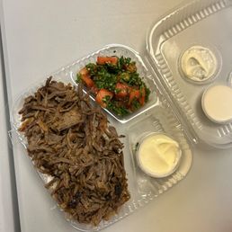 beef & lamb shawarma plate with tabbuleh, tahini, Nineveh sauce beef & lamb shawarma plate with tabbuleh, tahini, Nineveh sauce