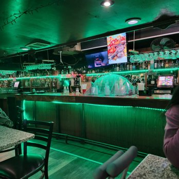 Dublin House - a woman sitting at a bar - Lounges Near Me - Dorchester, Massachusetts Dublin House - a woman sitting at a bar - Lounges Near Me - Dorchester, Massachusetts