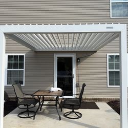 Colemans handyman - Brand new pergola with electric panels open.