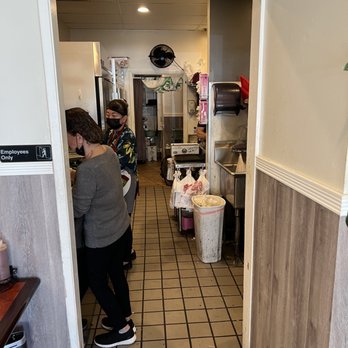 Pho Nhy - a woman standing in a kitchen - Vietnamese Near Me - San Jose, California Pho Nhy - a woman standing in a kitchen - Vietnamese Near Me - San Jose, California