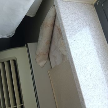 Comfort Suites West Warwick - Providence - Wallpaper next to the a/c unit and window was falling off the wall. - Hotels Near Me - West Warwick, Rhode Island