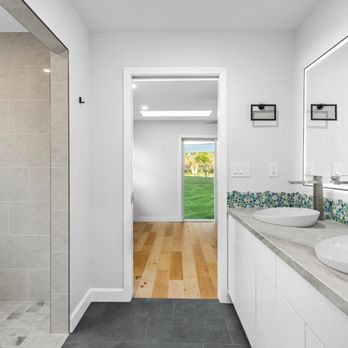 Nordic Contractors - THE AFTER: A beautiful bathroom upgrade with a curb-less shower and custom tile details. - General Contractors Near Me Nordic Contractors - THE AFTER: A beautiful bathroom upgrade with a curb-less shower and custom tile details. - General Contractors Near Me