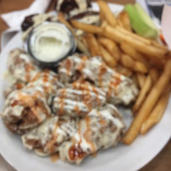 Wild Wings Restaurant - a plate of food with fries and dip - Chicken Wings Near Me - Wasaga Beach, Ontario Wild Wings Restaurant - a plate of food with fries and dip - Chicken Wings Near Me - Wasaga Beach, Ontario