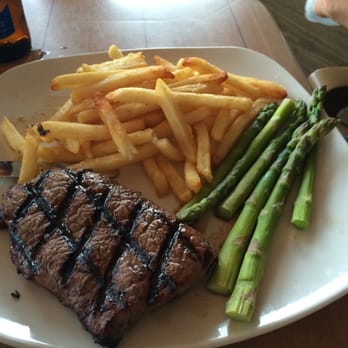 Coconuts On The Beach - Top Sirloin with asparagus and fries - Bars Near Me - Cocoa Beach, Florida