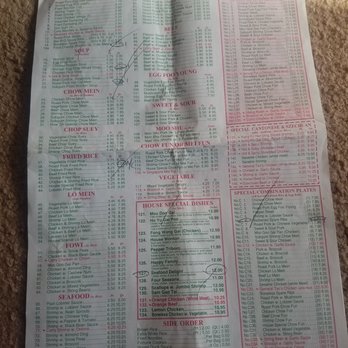 A folded Chinese restaurant takeout menu with various categories like chow mein, fried rice, and sweet & sour dishes, with some items circled.