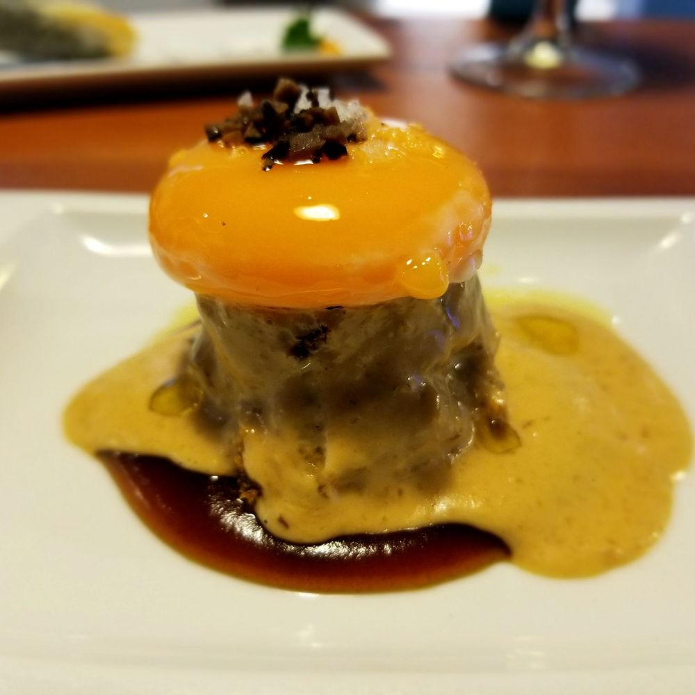 Eslava - slow cooked egg yolk over cake with mushroom cream sauce and Pedro Ximenez wine reduction - Tapas Bars Near Me - Seville, SE Eslava - slow cooked egg yolk over cake with mushroom cream sauce and Pedro Ximenez wine reduction - Tapas Bars Near Me - Seville, SE