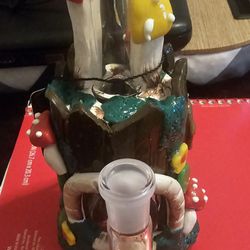 Happy Rock Smoke Shop - A pipe hanging off the shelf waiting for someone to accidentally have their arm or purse touch it and bam they get free money. Scum!