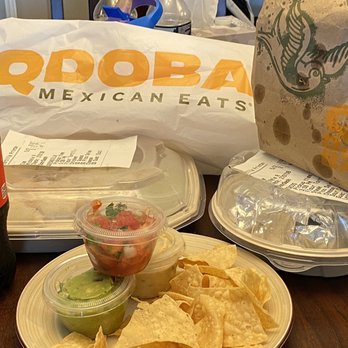 QDOBA Mexican Eats - a plate of nachos and a bottle of coke - Mexican Near Me - Falls Church, Virginia