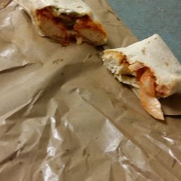 Half eaten chicken tender wrap