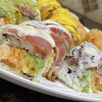 Onsen - a plate of sushi with different toppings - Japanese Near Me - Oakdale, New York Onsen - a plate of sushi with different toppings - Japanese Near Me - Oakdale, New York