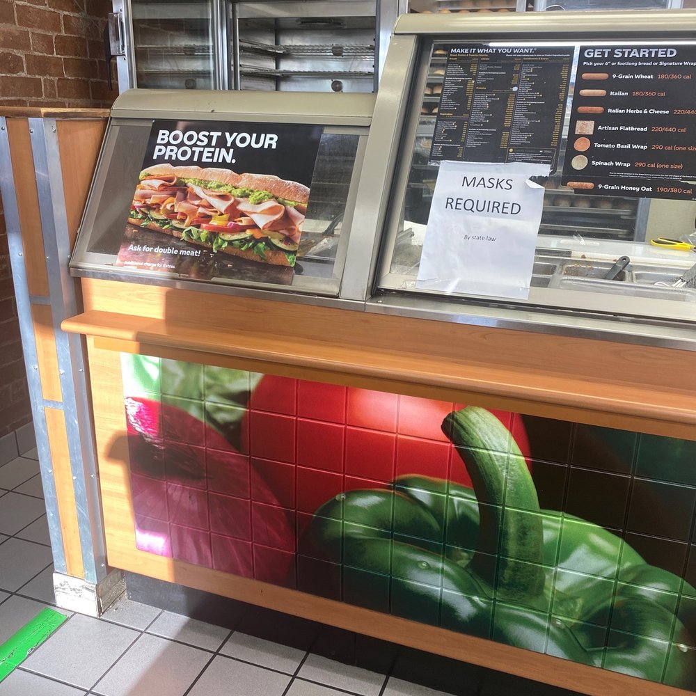 a counter with a menu for a restaurant a counter with a menu for a restaurant