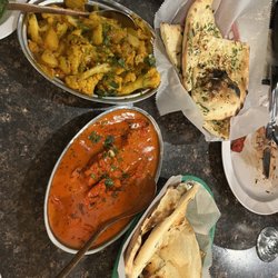 New Delhi Palace Cuisine of India - Butter Chicken Makhani Aloo Gobi Garlic Naan Bread Naan Bread