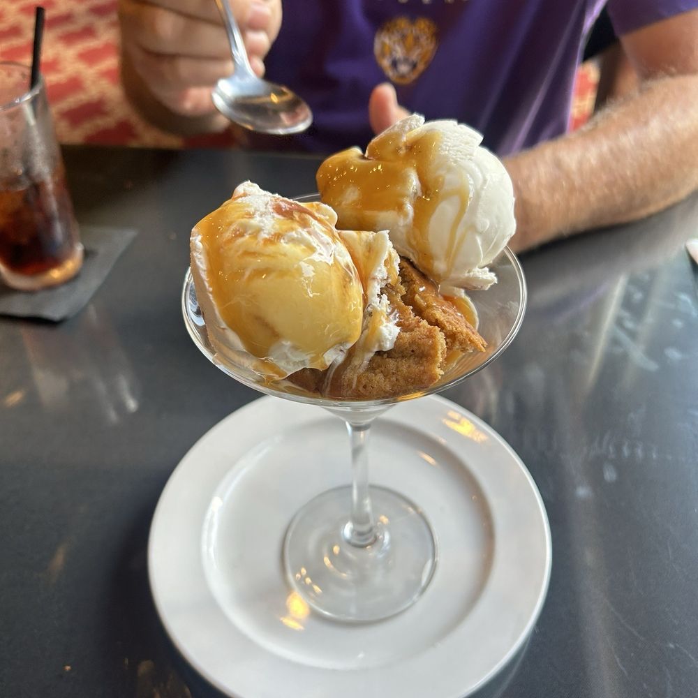 Praline ice cream with caramel whiskey sauce and cookie crumble