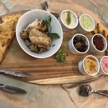 Nes Events - a plate of food and utensils - Caterers Near Me