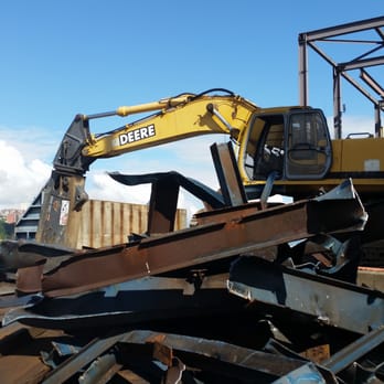 Simon Metals - Mobile shear on a demo site slicing through structural steel. - Recycling Center Near Me - Tacoma, Washington