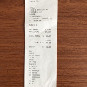 Shell - a receipt on a wooden table - Gas Stations Near Me - Phoenix, Arizona
