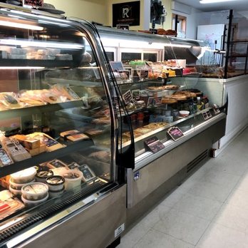 Auberge le Sunshine - a deli case filled with food - Bakeries Near Me - Stanstead, Quebec
