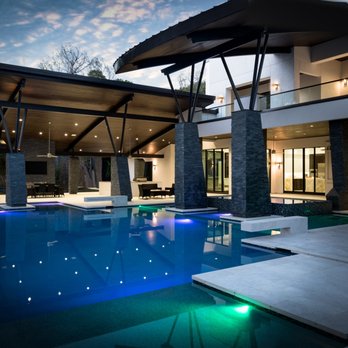Frankel Building Group - a pool in the evening - General Contractors Near Me - Houston, Texas Frankel Building Group - a pool in the evening - General Contractors Near Me - Houston, Texas