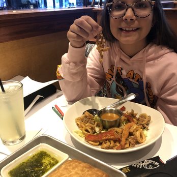 Bonefish Grill - My daughter with her calamari. - Seafood Near Me - Metairie, Louisiana Bonefish Grill - My daughter with her calamari. - Seafood Near Me - Metairie, Louisiana