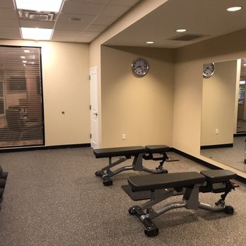 TownePlace Suites by Marriott - Free weights and benches in the gym. - Hotels Near Me - Dubuque, Iowa