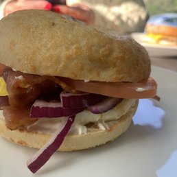 Homebody. Toasted Asiago bagel with cream cheese, bacon, fried egg, tomato, onion. Homebody. Toasted Asiago bagel with cream cheese, bacon, fried egg, tomato, onion.