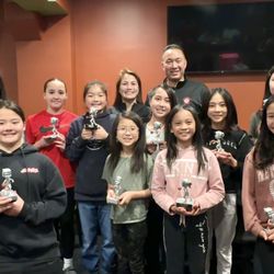 Victory Trophies - 2022-2023 Betsuin D-Girls basketball team holding their personalised trophies from Victory Trophies