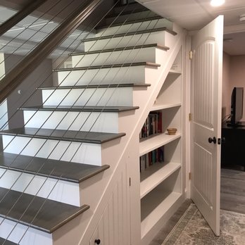 Butler Built Homes and Projects - Book shelf and storage on the other side of the stairs. - Flooring Near Me - Dedham, Maine