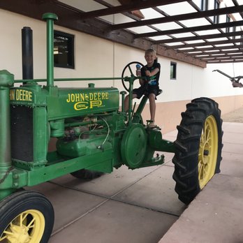 Southwest Specialty Food - a man standing on a tractor - Specialty Food Near Me - Goodyear, Arizona Southwest Specialty Food - a man standing on a tractor - Specialty Food Near Me - Goodyear, Arizona