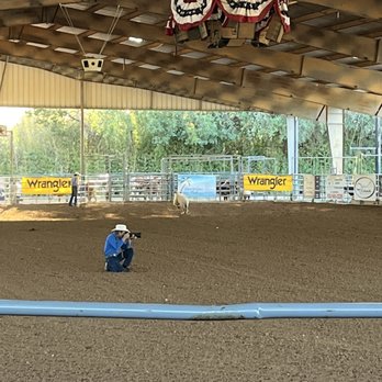 Tejas Rodeo - Camera man working hard. He was interesting to watch when he was trying to capture photos and dodge bullets Lol - Steakhouses Near Me - Bulverde, Texas
