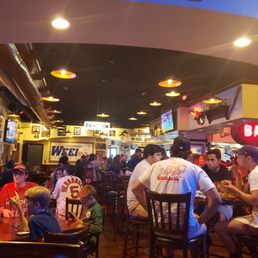 a large group of people sitting at tables a large group of people sitting at tables