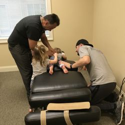 Pro Health & Rehab - 06-22-2017 Dr Charlie adjusting Stella (22mo) with the help of her big sister, age 3.