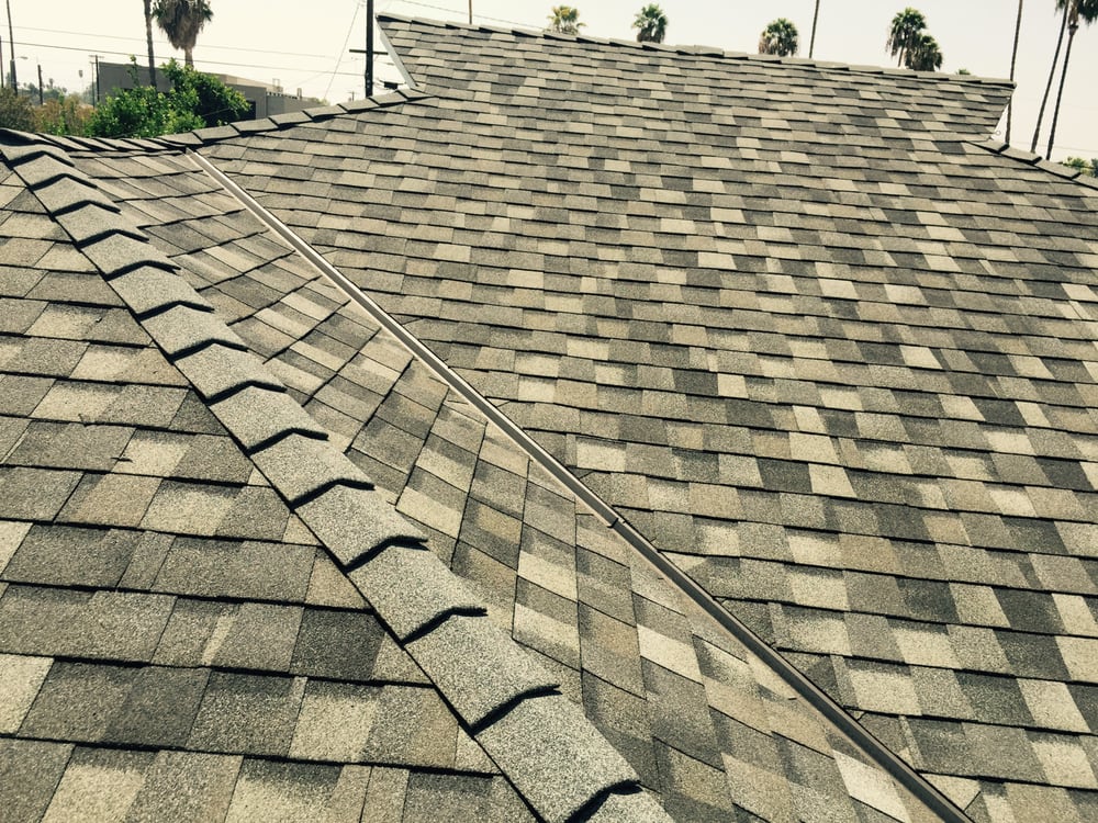 Slide of H&M ROOFING