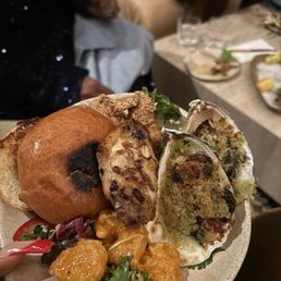 This is a boujie baby shower pic. It includes the wagyu burger, Rockefeller oysters, golden crisp bites, wings, and rock shrimp tempura. This is a boujie baby shower pic. It includes the wagyu burger, Rockefeller oysters, golden crisp bites, wings, and rock shrimp tempura.