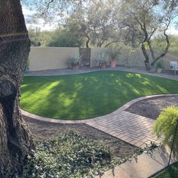 a backyard with artificial grass a backyard with artificial grass