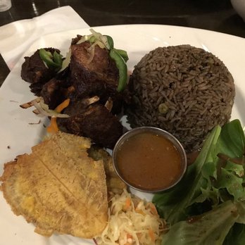 Gisele's Creole Cuisine - Goat with mushroom rice - Bars Near Me - Silver Spring, Maryland