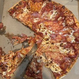 Incomplete pizza. No it wasn't hot when pulling slices, look at the in tact part...missing sauce, cheese, toppings