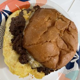 Egg, sausage sandwich on brioche bun. Egg, sausage sandwich on brioche bun.