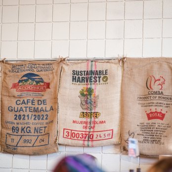 Switchpoint Coffee - three bags of coffee hanging on a wall - Coffee Roasteries Near Me - St. George, Utah Switchpoint Coffee - three bags of coffee hanging on a wall - Coffee Roasteries Near Me - St. George, Utah