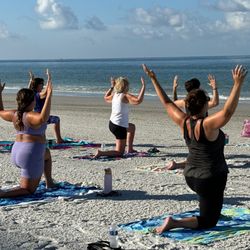 Madeira Beach Yoga - Heart openers to the sky at the shoreline are purely magical.  Beach yoga is fun and enjoyable.