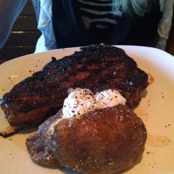 Outback Steakhouse - Bone-In Ribeye and baked potato - Steakhouses Near Me - Niles, Ohio Outback Steakhouse - Bone-In Ribeye and baked potato - Steakhouses Near Me - Niles, Ohio